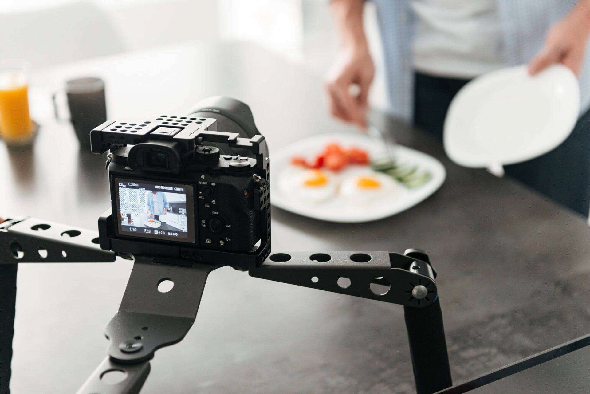Man recording video food blog about cooking